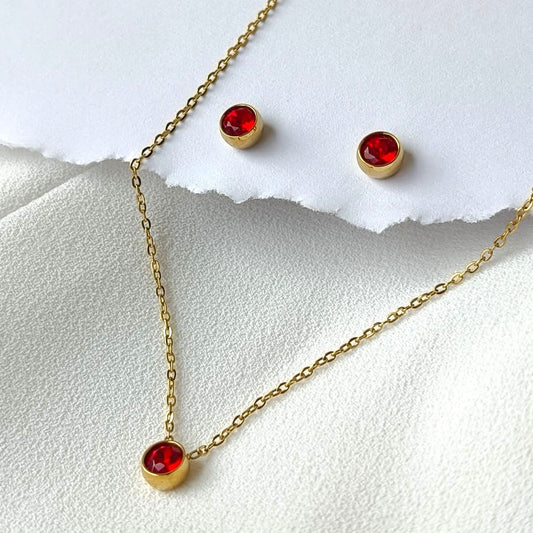 Conjunto em Aço Dourado com Pedras Vermelhas e Estilo Minimalista